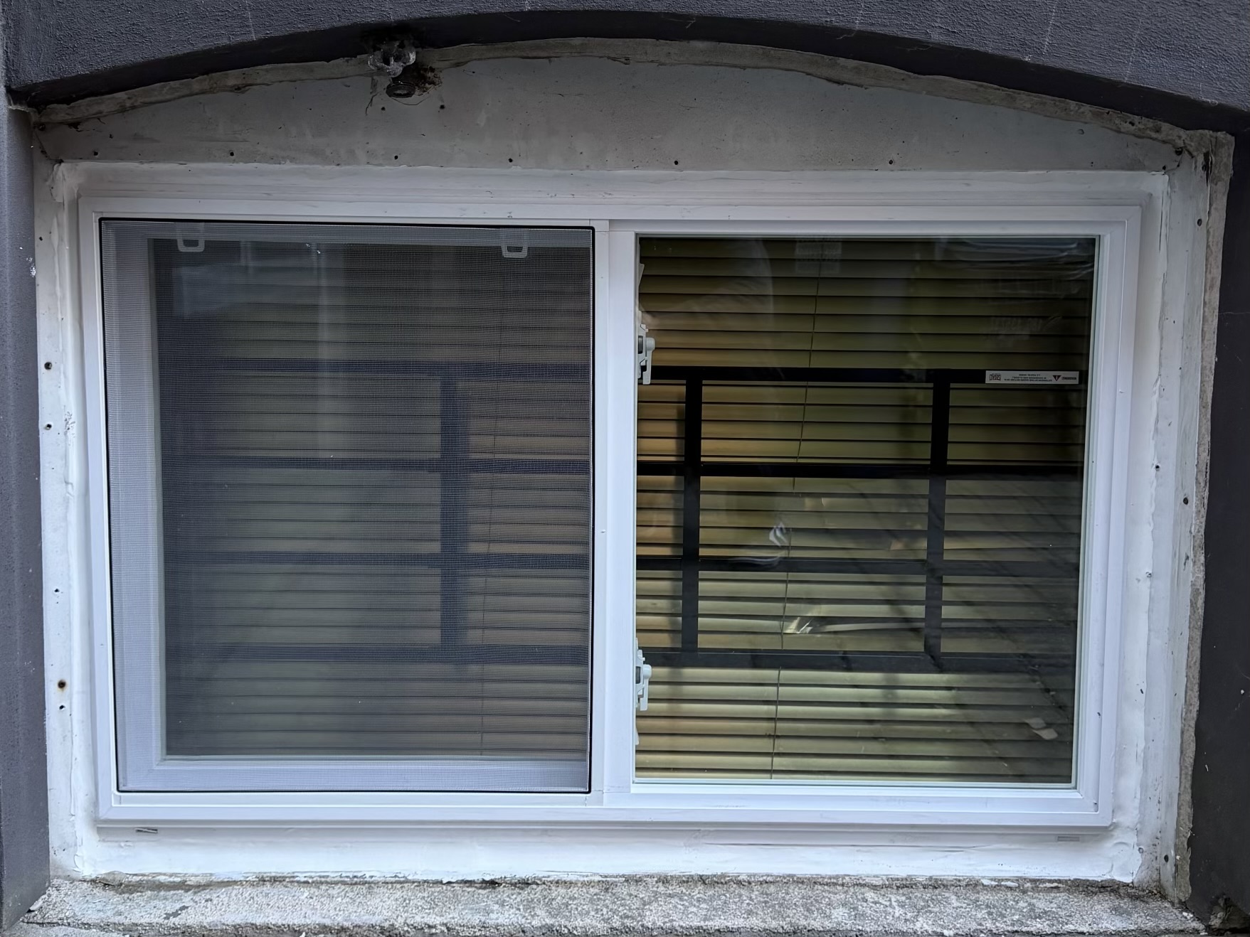 Etobicoke basement window after new glass installation