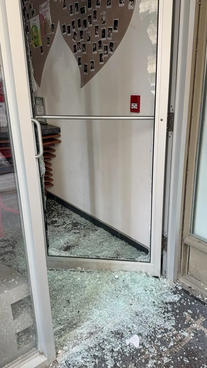 Toronto commercial entry door with shattered glass before replacement